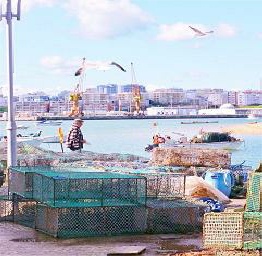 Ferragudo fishing port with stacked lobster pots
